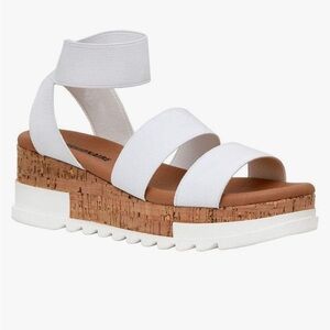 White sandals with elastic ankle straps